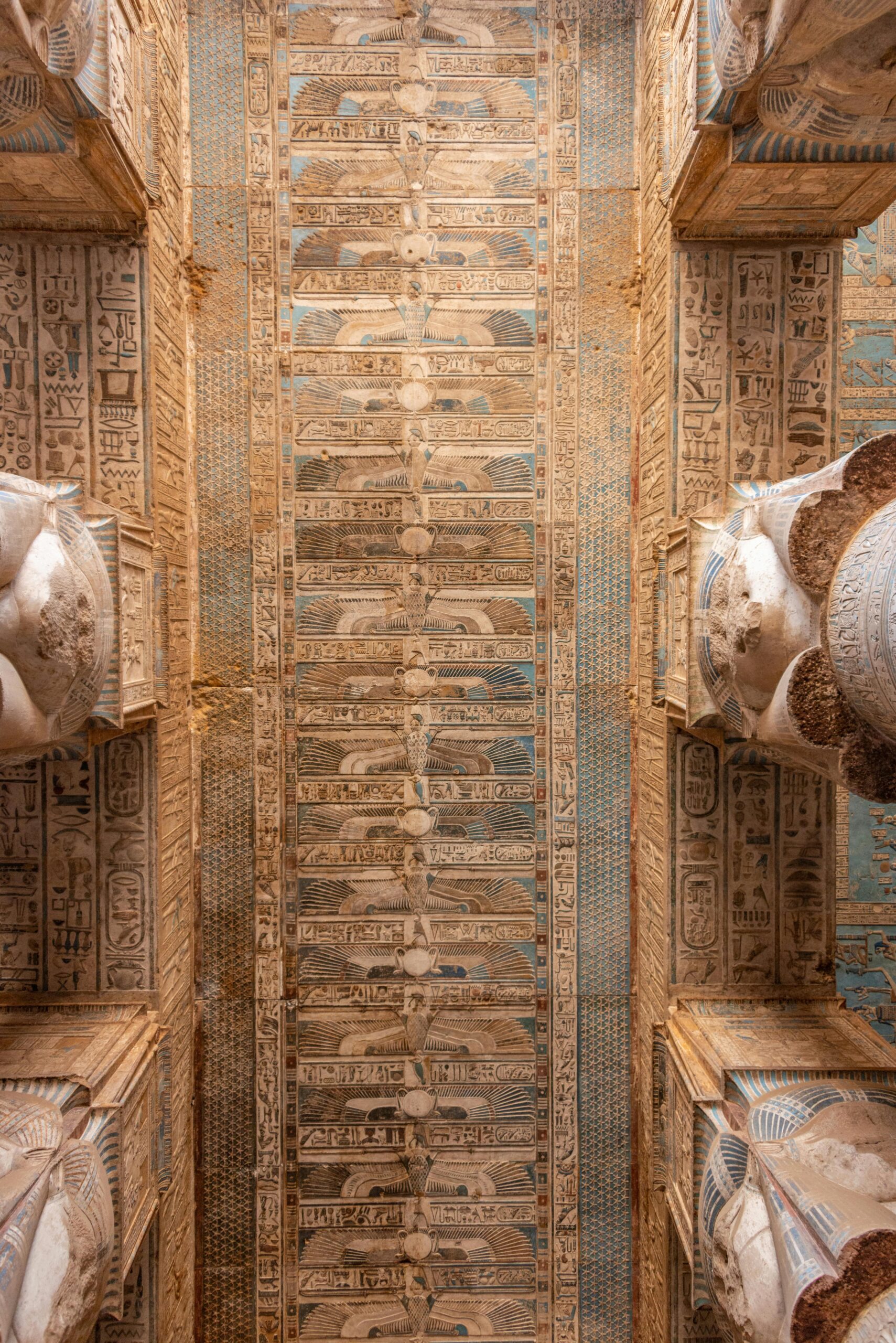 Close-up view of the ancient Egyptian ceiling with detailed hieroglyphs at Dendera Temple, capturing its cultural heritage.